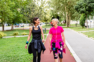 Two women walk for exercise