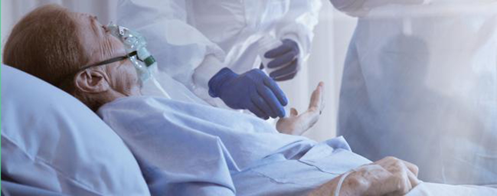 Patient in bed receiving care from a health professional