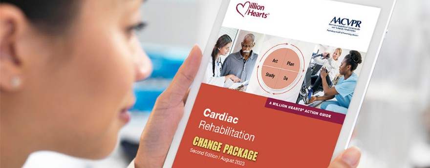 A woman holds a copy of the Million Hearts Cardiac Rehabilitation Change Package