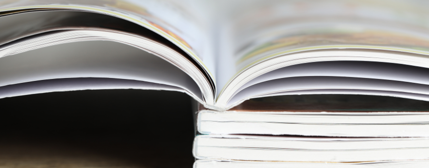 A closeup view of a stack of medical journals,